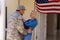 Caucasian blond woman hugging military soldier on his return home at the entrance