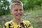 Caucasian boy crying outdoors alone. suffering child portrait.