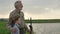 caucasian Boy with grandpa fly fishing outdoor over river background. Fishing