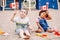 Caucasian boy and latin hispanic baby girl holding waving Canadian flags. Multiracial children celebrating Canada Day