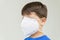 Caucasian boy with surgical mask covering his face