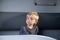 Caucasian boy in a train compartment. The passenger travels in the train cabin