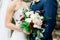 Caucasian Bride and Groom with a Rose Wedding Bouquet, Bridal Detail