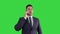 Caucasian business person answering several calls being serious and concentrated on a Green Screen, Chroma Key.