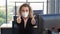 Caucasian businesswoman with medical mask for coronavirus covid-19 protection working in office and thumb up showing support to