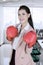 Caucasian businesswoman wearing boxing gloves