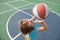Caucasian child play basketball. Kids sport face.