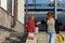 Caucasian child of two years old walking down holding the mother hand supporting woman