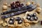 Caucasian churchkhela with grapes and walnuts on a wooden background.