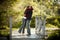 Caucasian couple hugging on outdoor wooden bridge