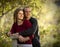 Caucasian couple in love on outdoor wooden bridge