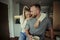 Caucasian couple standing in kitchen being romantic hugging each other