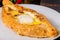 Caucasian dish khachapuri with egg served on a white plate