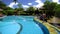 Caucasian Dutch woman walking along luxury pool