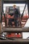 Caucasian engineer and heavy machine operator with container forklift at containers yard and cargo