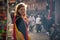 Caucasian european white traveler girl portrait in the narrow crowded busy streets of Medina Marrakech, Morocco