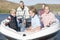 Caucasian Family Of Five In Speedboat