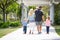 Caucasian Family of Five Taking A Walk In The Park