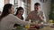 Caucasian family of three eating breakfast together.