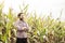 Caucasian farmer in plaid shirt and corn field - agriculture