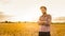 Caucasian farmer in plaid shirt and wheat field - agriculture