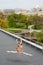 Caucasian fashion ballerina leaping on the roof