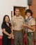 Caucasian father, Korean mother and teenage Amerasian son before a ceremony for Eagle Scout recognition in Edmond, Oklahoma.