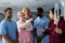 Caucasian female doctor with diverse trainee doctors applying drip at hospital