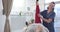 Caucasian female physiotherapist stretching prosthetic leg of female patient at hospital