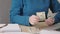 caucasian female woman hands counting paper American dollar money, calculator
