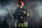 Caucasian fireman in uniform stand in smoke