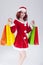 Caucasian Ginger Santa Helper Girl with Plenty of Colorful Shopping Bags