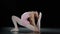 Caucasian girl ballerina teenager gymnast acrobat doing back bend position dancing element stretching exercises athletic