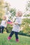 Caucasian girl and boy children waving American flag in park outside celebrating 4th july, Independence Day