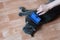 Caucasian girl combing gray cat. Lying on floor of the room