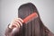 Caucasian girl combing her hair