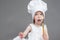 Caucasian Girl in Cook Uniform Posing with Whisk Covered with Flour.