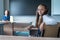 Caucasian girl and her teacher in the classroom. Schoolgirl turns around and looks at the camera.