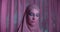 Caucasian girl hijab neon make-up portrait light night purple violet white background