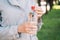 Caucasian girl holds plastic water in hands