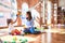 Caucasian girl kid playing and learning at playschool with female teacher