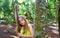 Caucasian girl playing in rainforest jungle