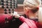 Caucasian girl pushing elevator button with disinfecting wet wipe. Precaution against a virus spread. COVID-19 coronavirus danger