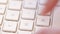 Caucasian hands typing on laptop keyboard. Closeup of corporate desk