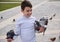 Caucasian happy child boy feeding feral pigeons in the square of a city park. Children, nature and animals concept