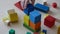 Caucasian kid playing together with wooden bricks