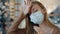 Caucasian lady sick suffering blonde girl ill woman wearing medical mask holding temples forehead feeling fear flu virus