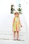 Caucasian Little Blond Girl Walking Tropical Garden