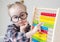 Caucasian little girl with round glasses