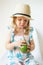 Caucasian Little Girl in Straw Beach Hat Drinking Green Smoothie Juicy Summer Concept White Background